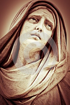 Suffering religious woman statue