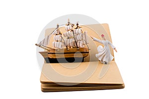 Sufi Dervish and a ship on a notebook