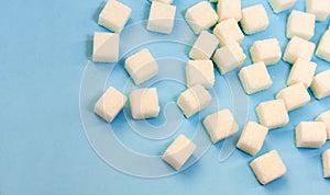 Sugar addiction, insulin resistance, unhealthy diet, sugar cubes on blue background, diabetes protection concept, top view