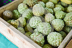 Sugar apple on wooden box in the fruit market Asian -  Annona sweetsop or or custard apple