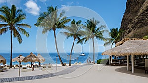 Sugar beach Saint Lucia ,white tropical beach palm trees and luxury beach chairs St Lucia Caribbean