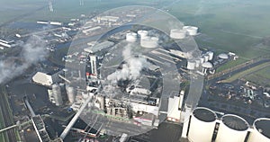 sugar beet processing factory with smokestacks in the agricultural business. Large industrial facility. Birds eye aerial
