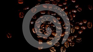 Sugar being pored onto a pile of coffee. Against black background