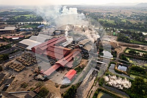 Sugar bioethanol translation factory working with steam from the chimney and sugarcane truck