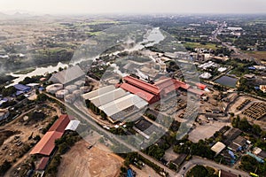 Sugar bioethanol translation factory working with steam from the chimney and sugarcane truck