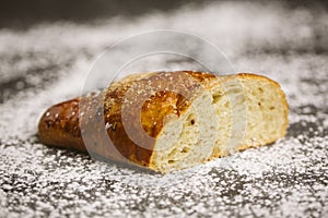 Sugar bun on a wooden background.