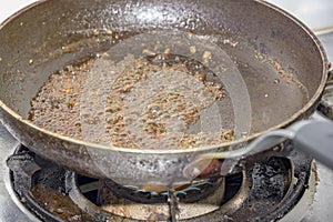 Sugar caramelizing in a frying pan