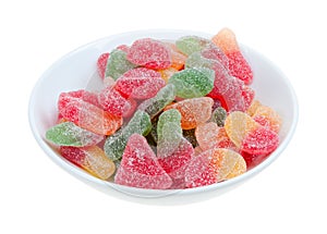 Sugar coated gumdrops in a bowl isolated