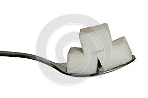 Sugar cobes on a teaspoon