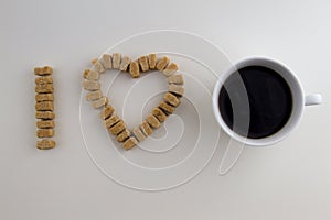 Sugar cubes arranged as I love coffee concept