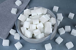 Sugar cubes in blue bowl