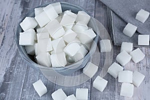 Sugar cubes in blue bowl