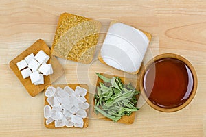 Sugar cubes, brown sugar crystals, granulated white sugar, rock sugar, stevia, honey, Different types of sweetness photo