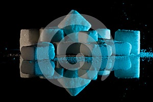 Sugar cubes on glass