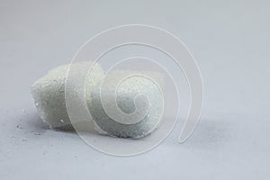 Sugar Cubes on Isolated White Background with Harsh Shadow, which can be used to imply dark side of Sugar.