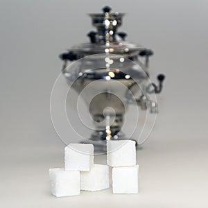 Sugar cubes and retro russian samovar