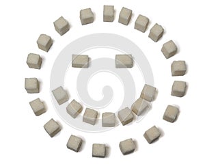 Sugar cubes in a smile pose, isolated on a white background.