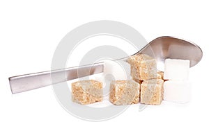 Sugar cubes and tea spoon