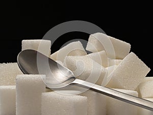 Sugar cubes and tea-spoon