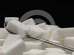 Sugar cubes and tea-spoon