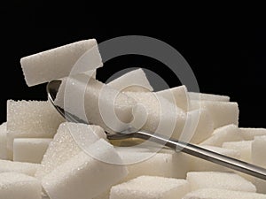 Sugar cubes and tea-spoon