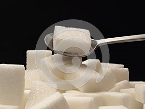 Sugar cubes and tea-spoon