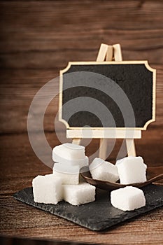 Sugar cubes with wooden spoon