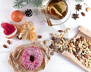 Sugar donut and tea on white background