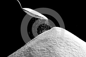 Sugar Falling from Spoon