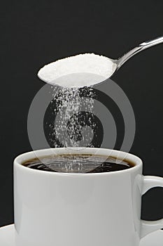 Sugar falling from a spoon
