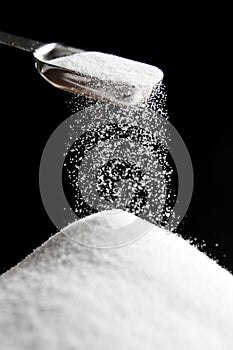 Sugar Falling from Tablespoon