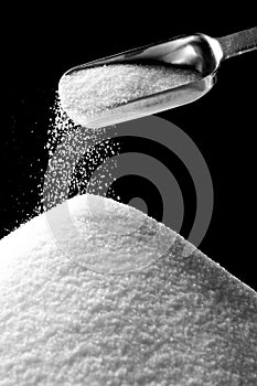 Sugar Falling from Tablespoon