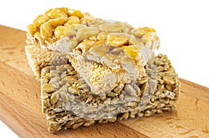 Sugar glazed kozinak, sunflower seeds and peanuts in sugar glaze, oriental sweets close-up macro