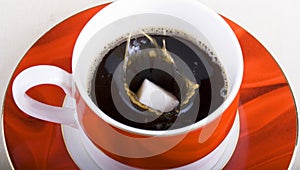 Sugar Lump Falling into Cup of Tea