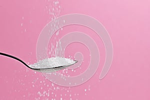 Sugar Pouring From A Spoon