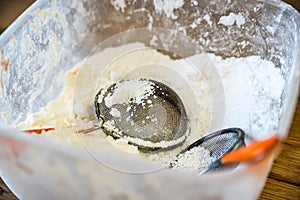 Sugar powder and two sifters in container