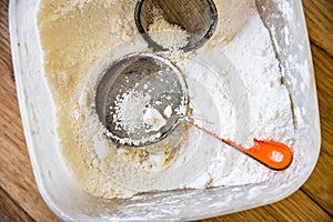 Sugar powder and two sifters in container