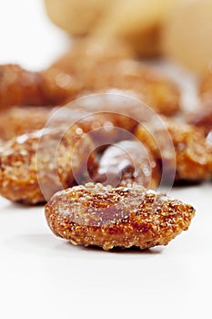 Sugar roasted almonds on white background