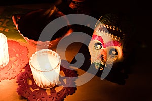 Sugar skull and candles - Calaverita - Ofrenda Dia de muertos photo