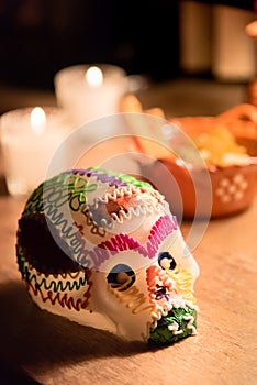 Sugar skull and candles - Calaverita - Ofrenda Dia de muertos photo