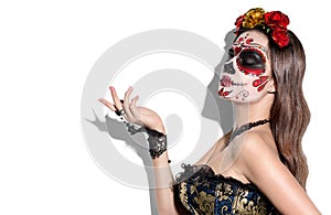 Sugar skull makeup. Halloween party, traditional Mexican carnival, Santa Muerte. Beautiful young woman costume