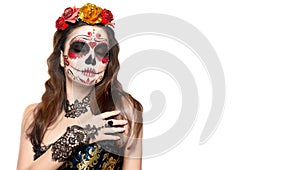 Sugar skull makeup. Halloween party, traditional Mexican carnival, Santa Muerte. Beautiful young woman costume