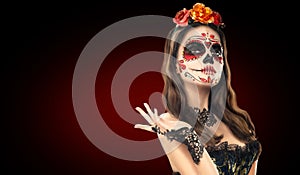 Sugar skull makeup. Halloween party, traditional Mexican carnival, Santa Muerte. Beautiful young woman costume