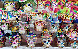 sugar skulls decorated in a traditional mexican market to celebrate day of the dead