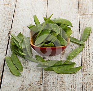 Sugar snap peas in Wooden Bowl