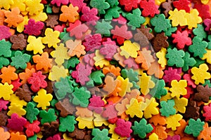 Sugar sprinkle leaves, decoration for cake and bekery, a lot of sprinkles as food background