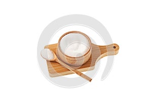Sugar substitute in bowl on wooden board isolated on white background. Stevioside powder or Stevia sweetener. Food additive E960