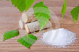 Sugar substitute xylitol, heap of birch sugar, liefs and wood