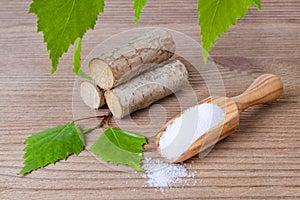 Sugar substitute xylitol, scoop with birch sugar, liefs and wood