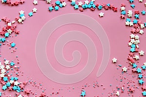 Sugar topping for cake, frame on a pink background, free space for text.